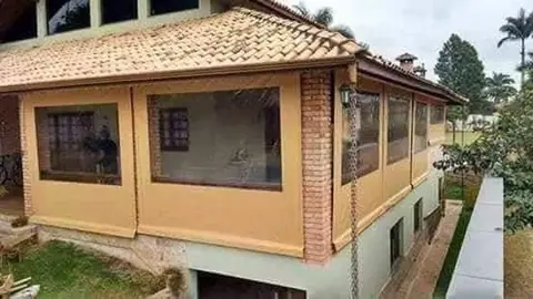 Toldo cortina em lona com visor cristal em varanda em São Paulo